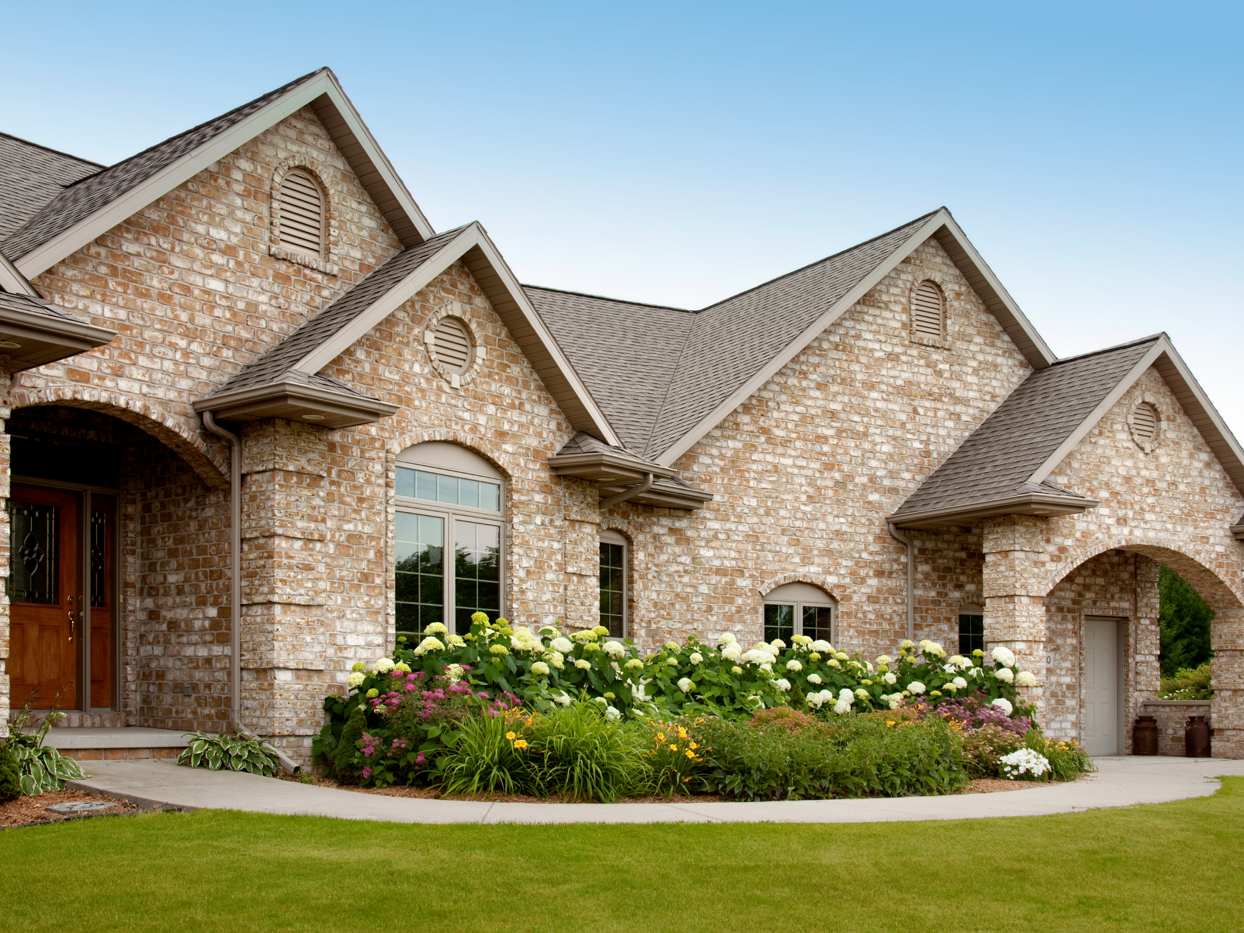 brick home with new roof