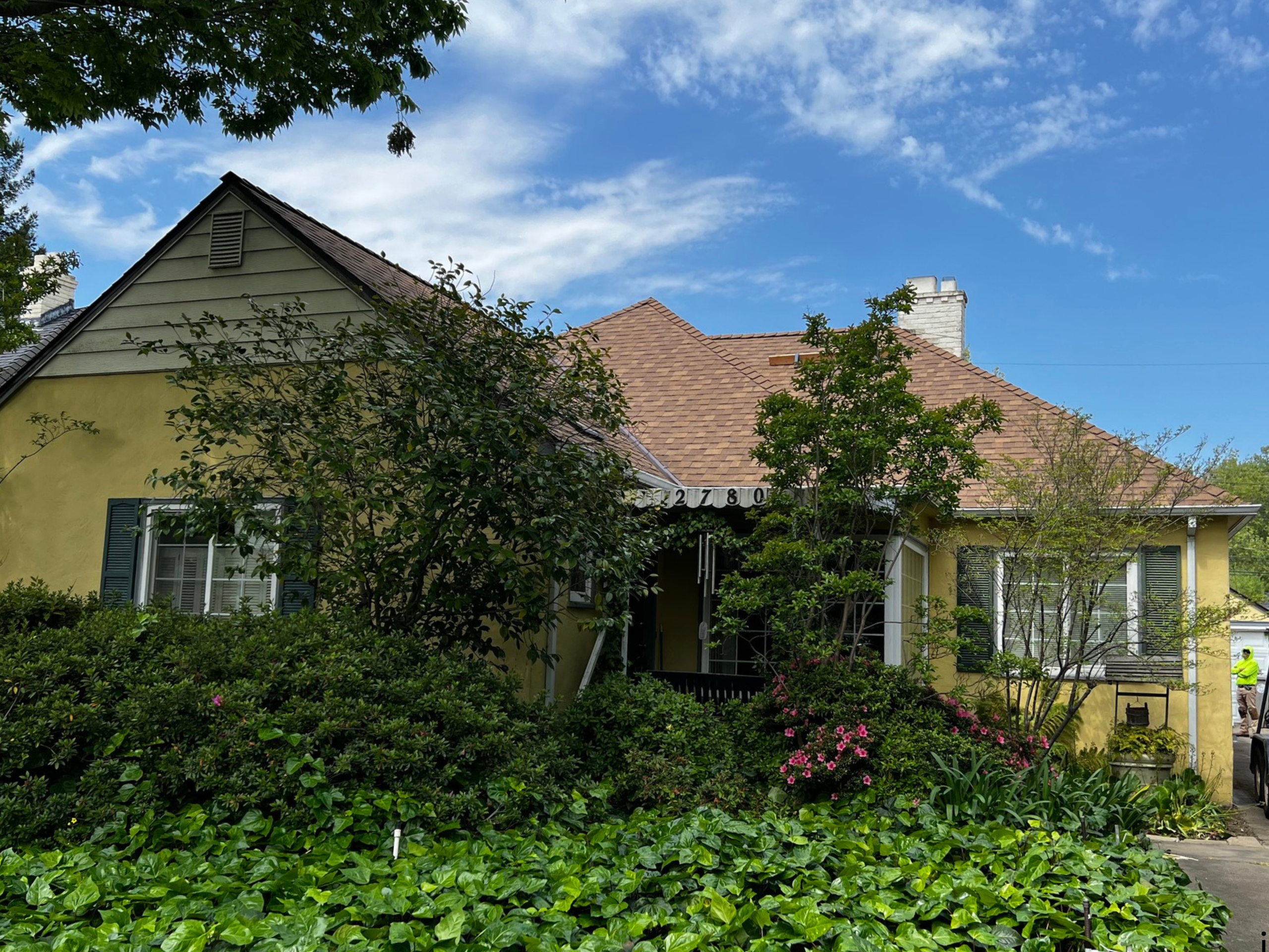 Yellow house with new roof